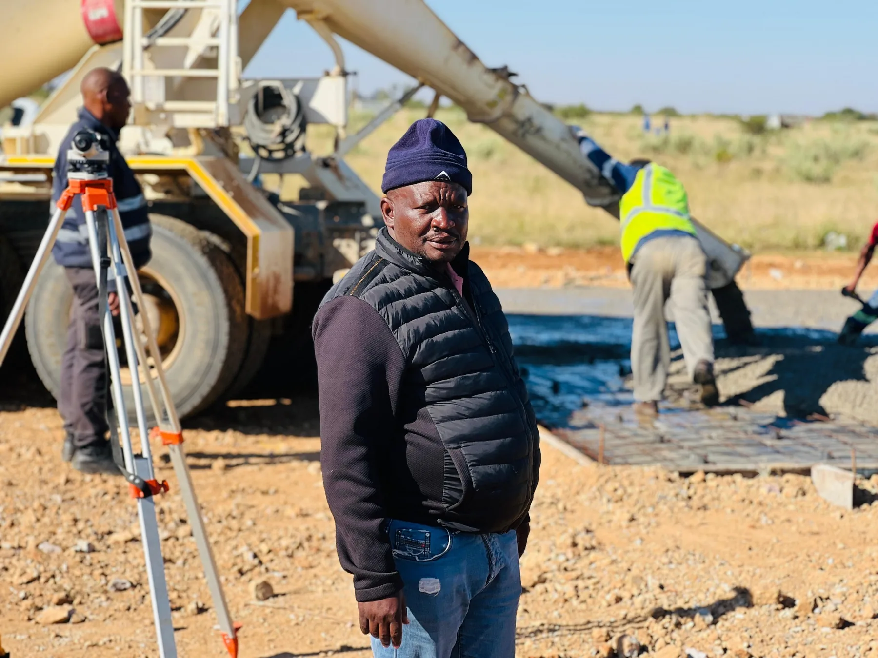 Beyond Build site manager supervising concrete placement